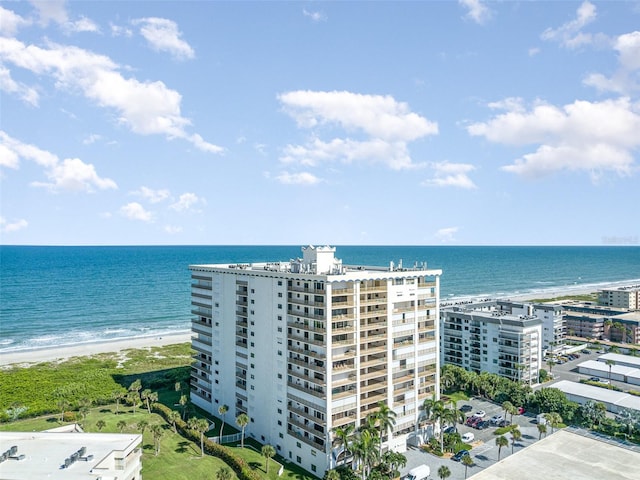 drone / aerial view featuring a view of the beach and a water view