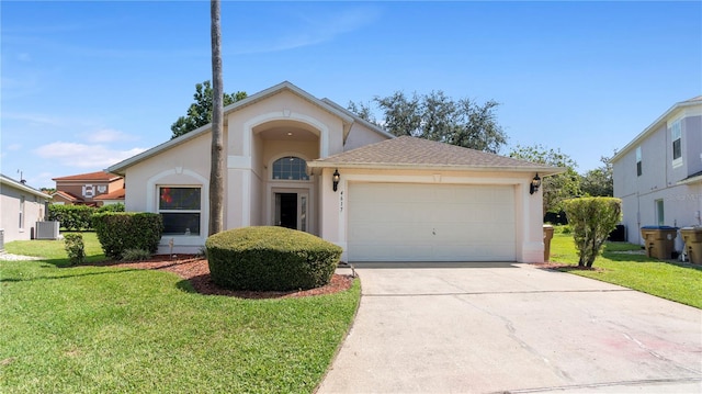 view of front of property with cooling unit, a front lawn, and a garage