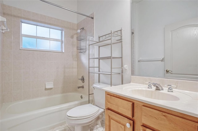 full bathroom featuring vanity, toilet, tile patterned flooring, and tiled shower / bath