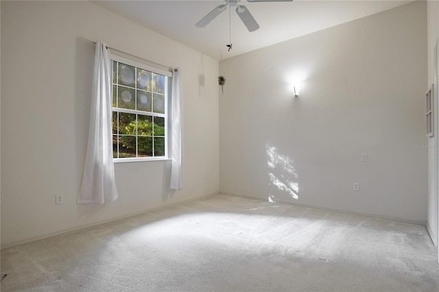 spare room with ceiling fan and carpet floors