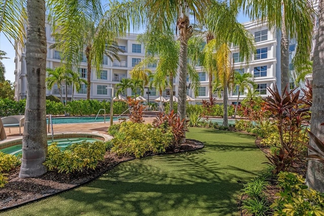 view of home's community featuring a lawn