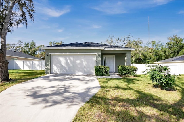 view of front facade with a front yard and a garage