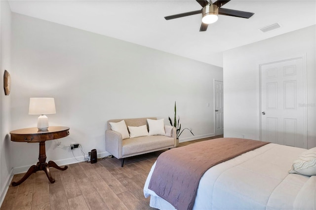 bedroom featuring hardwood / wood-style flooring and ceiling fan