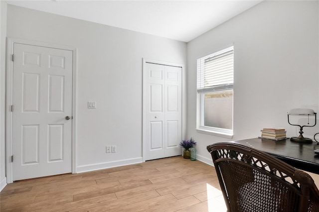 office with light hardwood / wood-style floors