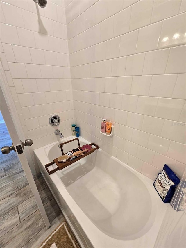 bathroom with hardwood / wood-style floors