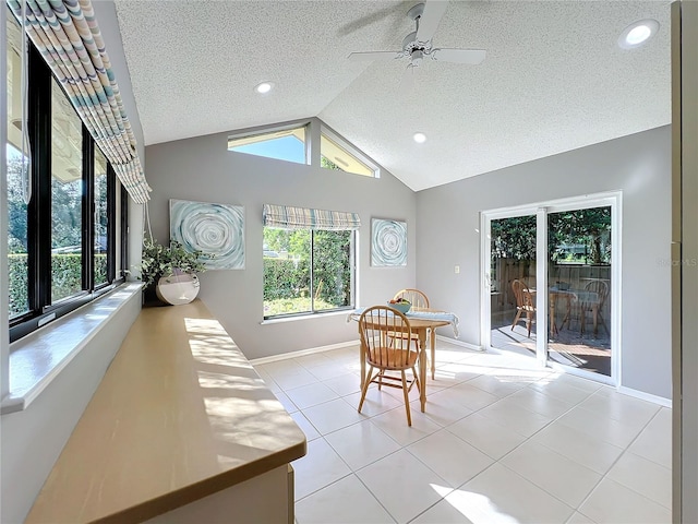 sunroom / solarium featuring lofted ceiling and ceiling fan