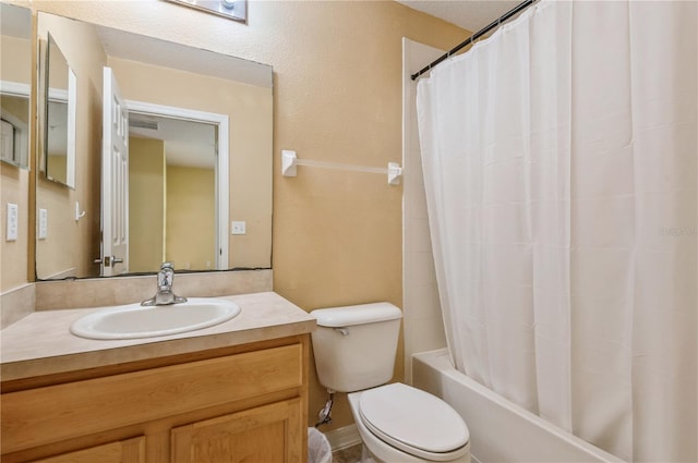 full bathroom with toilet, vanity, and shower / tub combo