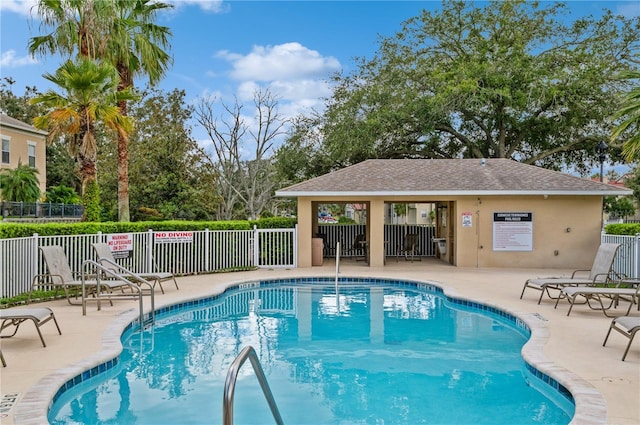 view of swimming pool with a patio