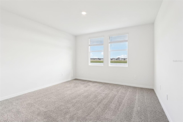 empty room with carpet flooring