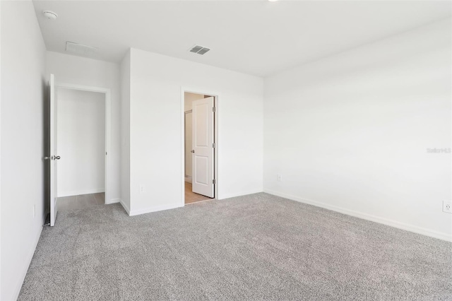 unfurnished bedroom featuring light colored carpet