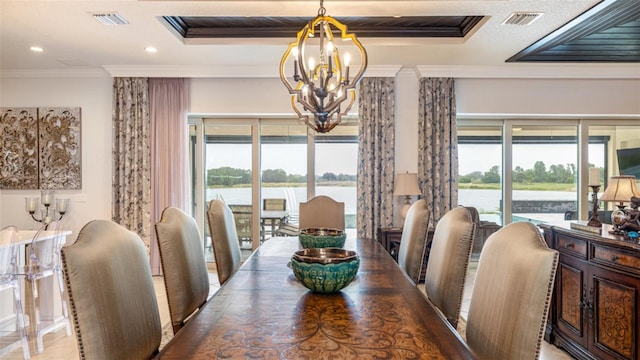 dining space featuring an inviting chandelier and crown molding