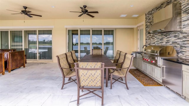 view of patio / terrace with area for grilling, ceiling fan, and a grill