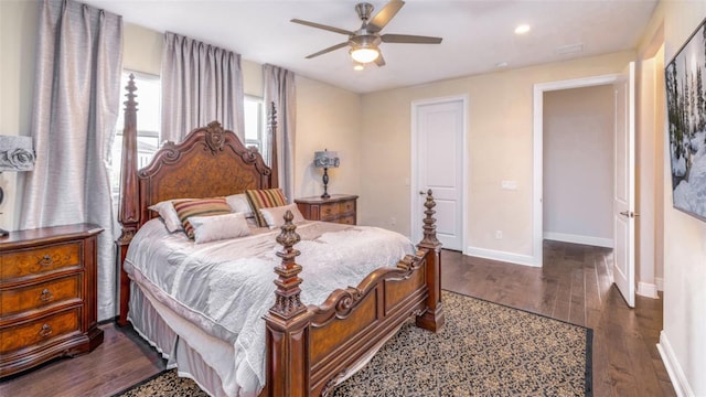 bedroom with dark wood-type flooring and ceiling fan