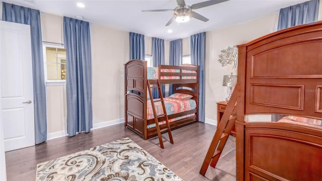 bedroom with wood-type flooring and ceiling fan