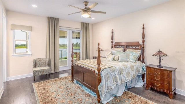 bedroom featuring access to exterior, ceiling fan, multiple windows, and dark hardwood / wood-style flooring