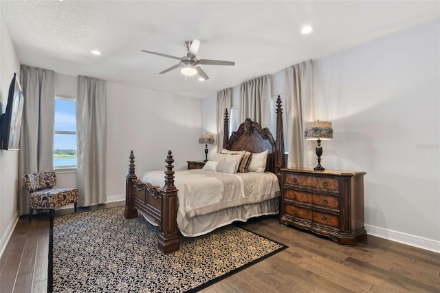 bedroom with ceiling fan and hardwood / wood-style flooring