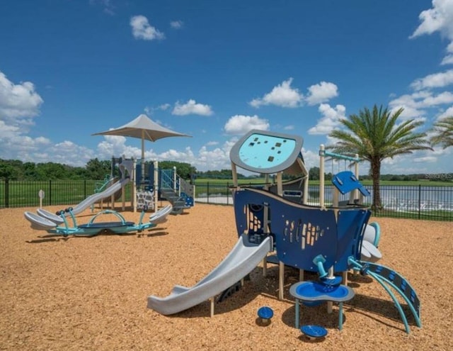 view of play area with a water view