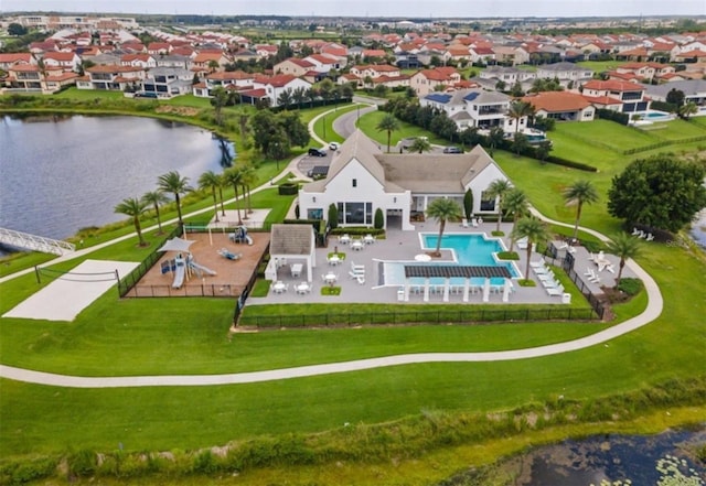 birds eye view of property with a water view