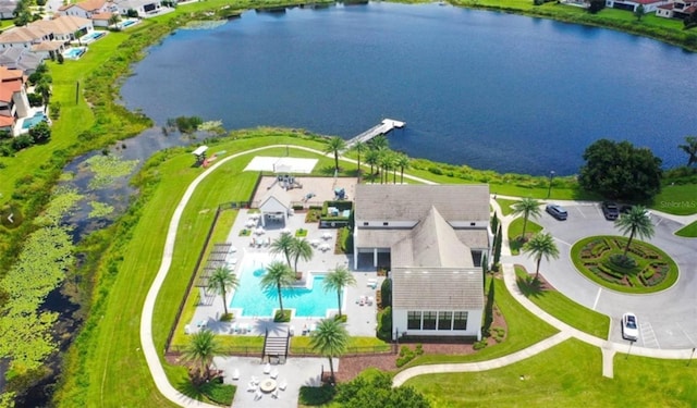 birds eye view of property with a water view