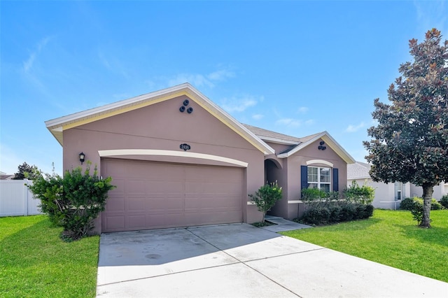 ranch-style home with a front lawn and a garage