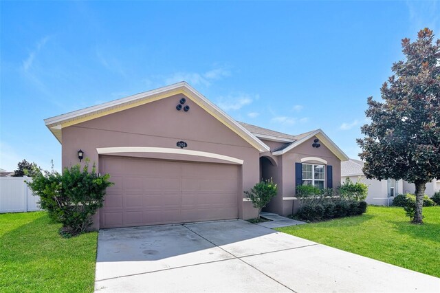 2036 Van Buren Loop, Auburndale, FL 33823 - single story home featuring stucco siding, an attached garage, and concrete driveway