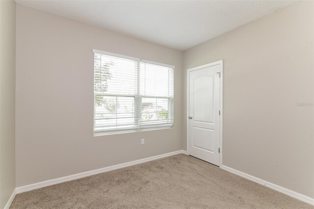 2036 Van Buren Loop, Auburndale, FL 33823 - spare room with light colored carpet and baseboards