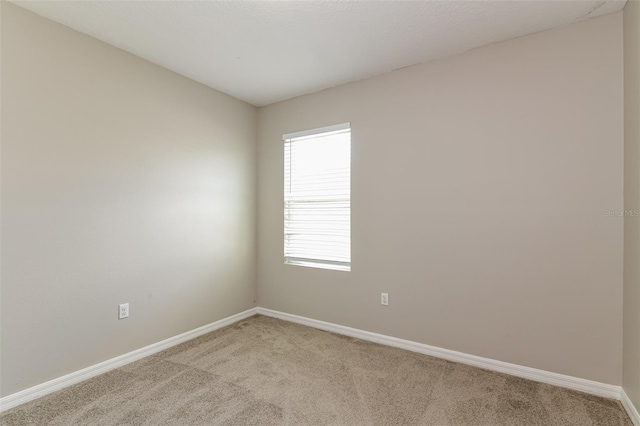 empty room with light colored carpet