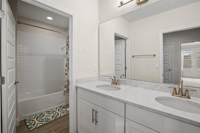 bathroom featuring vanity and shower / tub combo with curtain