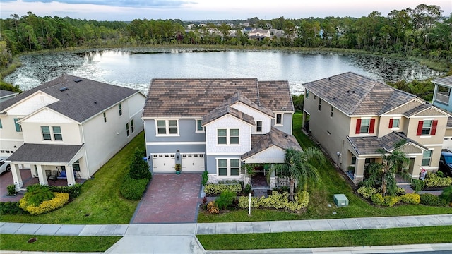 birds eye view of property featuring a water view