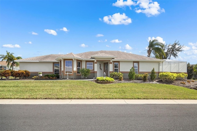 ranch-style home with a front lawn