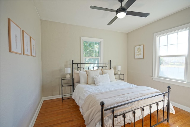 bedroom featuring hardwood / wood-style flooring and ceiling fan