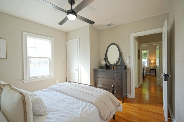 bedroom featuring wood-type flooring and ceiling fan