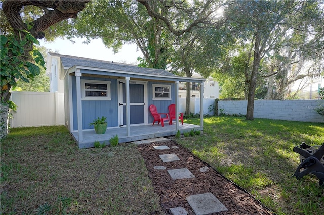 view of outbuilding featuring a lawn