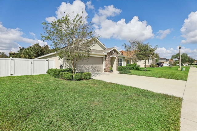 view of front of house with a front yard and a garage