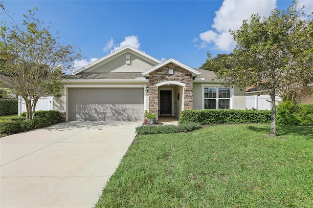 view of front of house featuring a front yard and a garage