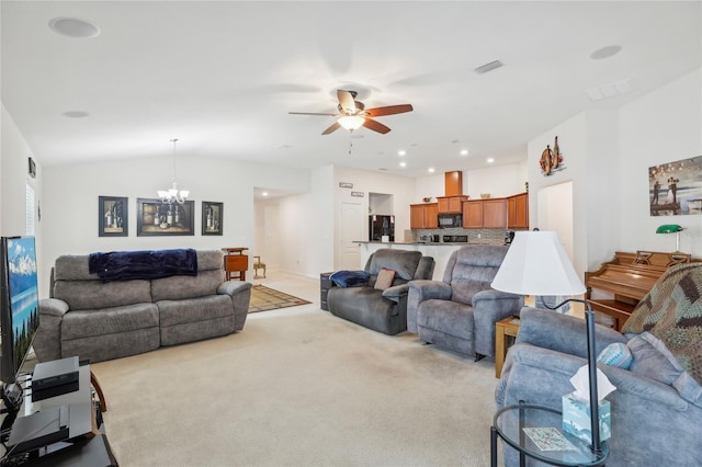 carpeted living room with lofted ceiling and ceiling fan with notable chandelier