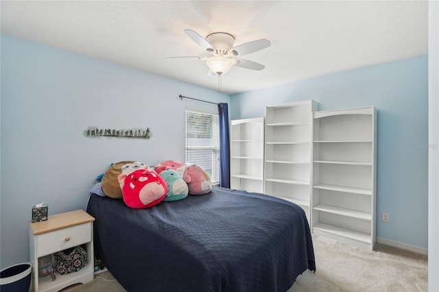 bedroom with ceiling fan and light colored carpet