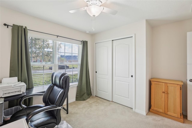 office area with light colored carpet and ceiling fan