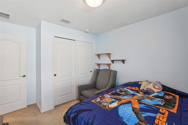 carpeted bedroom with a closet