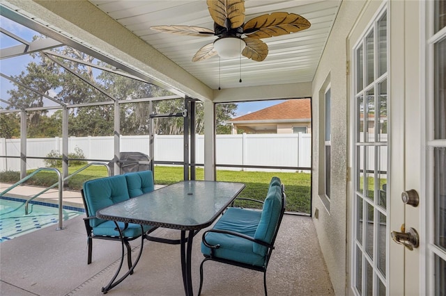 sunroom / solarium with ceiling fan