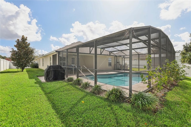 view of pool featuring a patio, a lanai, and a lawn