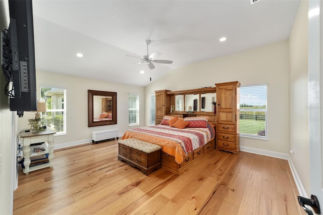 bedroom featuring lofted ceiling, light hardwood / wood-style flooring, and ceiling fan