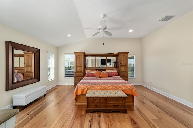 bedroom with vaulted ceiling, light wood-type flooring, and ceiling fan