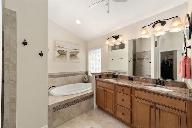 bathroom with vanity, tile patterned floors, separate shower and tub, and vaulted ceiling