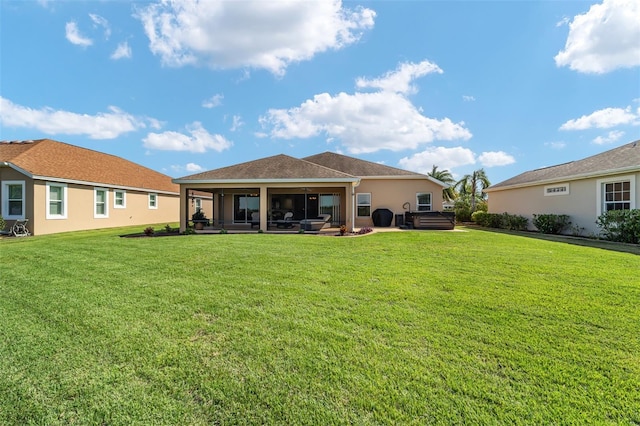 rear view of house with a patio area and a lawn