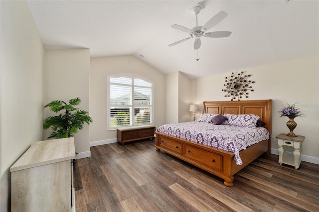 bedroom featuring lofted ceiling, dark hardwood / wood-style floors, and ceiling fan