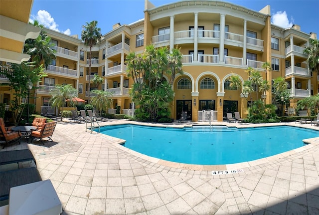 view of swimming pool featuring a patio