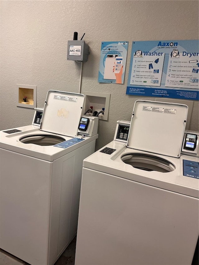 washroom with washer and dryer