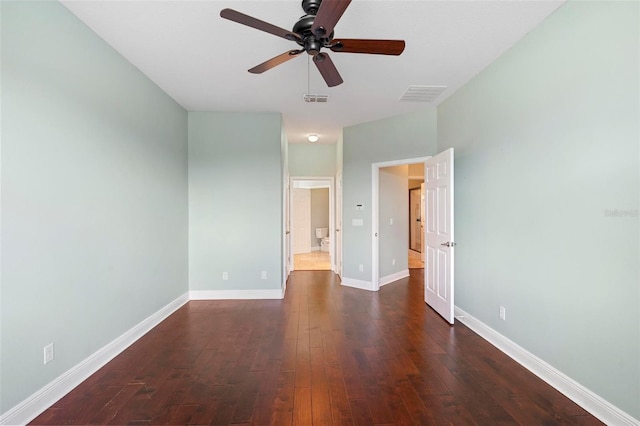 unfurnished bedroom featuring ceiling fan and dark hardwood / wood-style floors