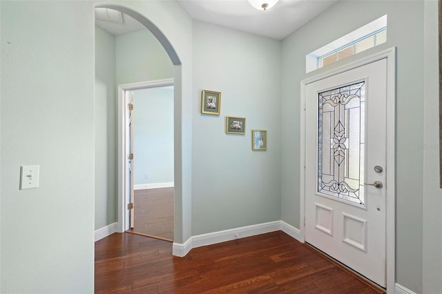 foyer entrance with dark hardwood / wood-style floors